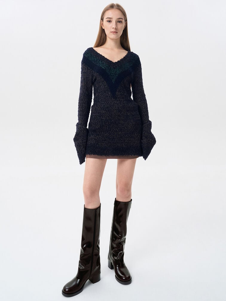 Side-zip knee-high boots perfectly complement a cosy knit sweater dress.