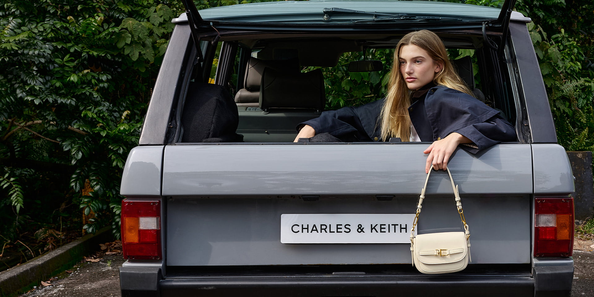 Women’s Gwynne metallic-accent saddle crossbody bag in cream - CHARLES & KEITH