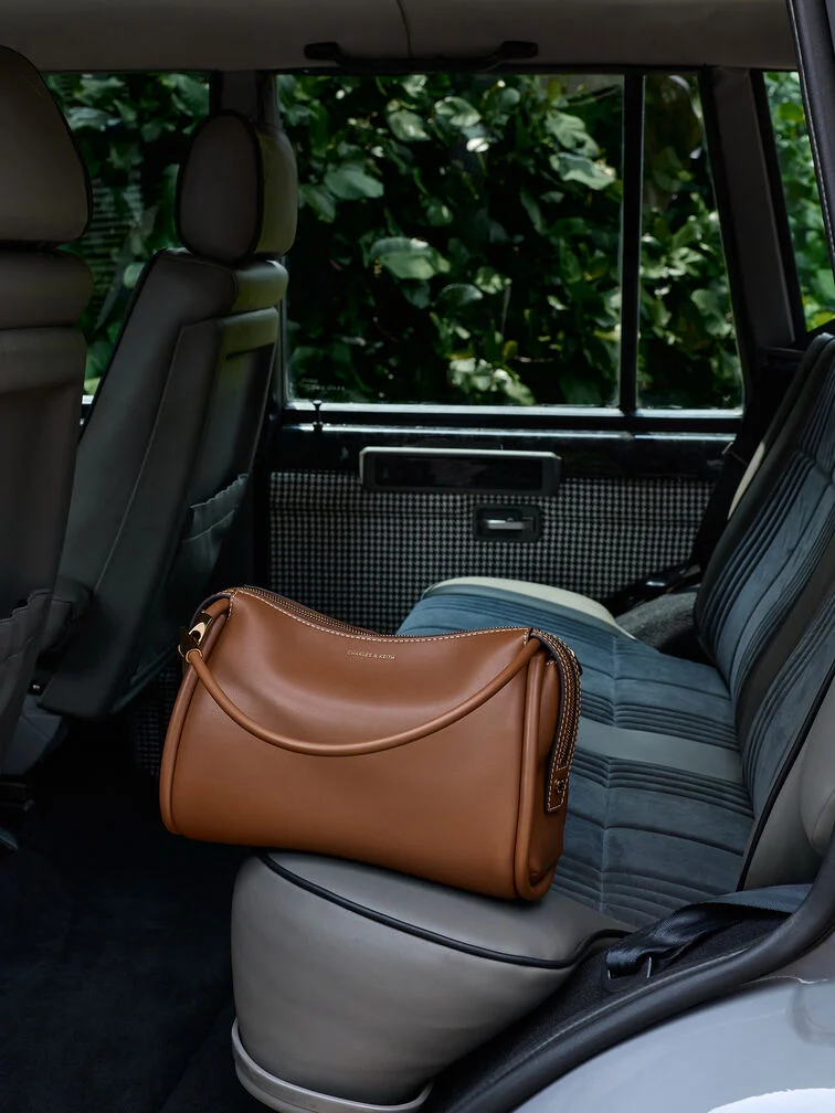 Slouchy shoulder bag with a structured base strikes the perfect balance.