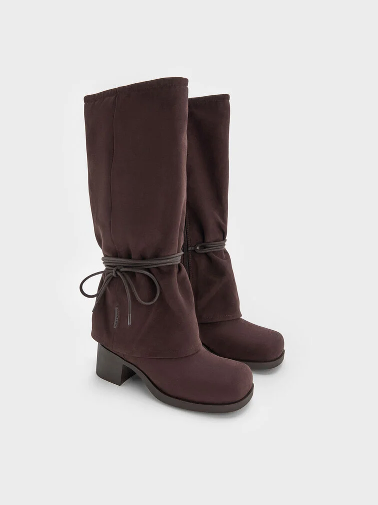 Dark brown tie-around knee-high boots in a faux suede finish.