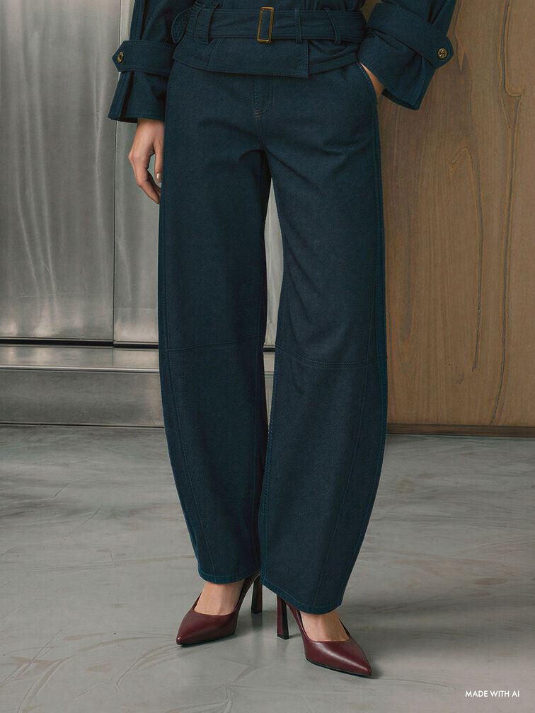 Burgundy pointed-toe pumps pair effortlessly with dark-wash barrel jeans.