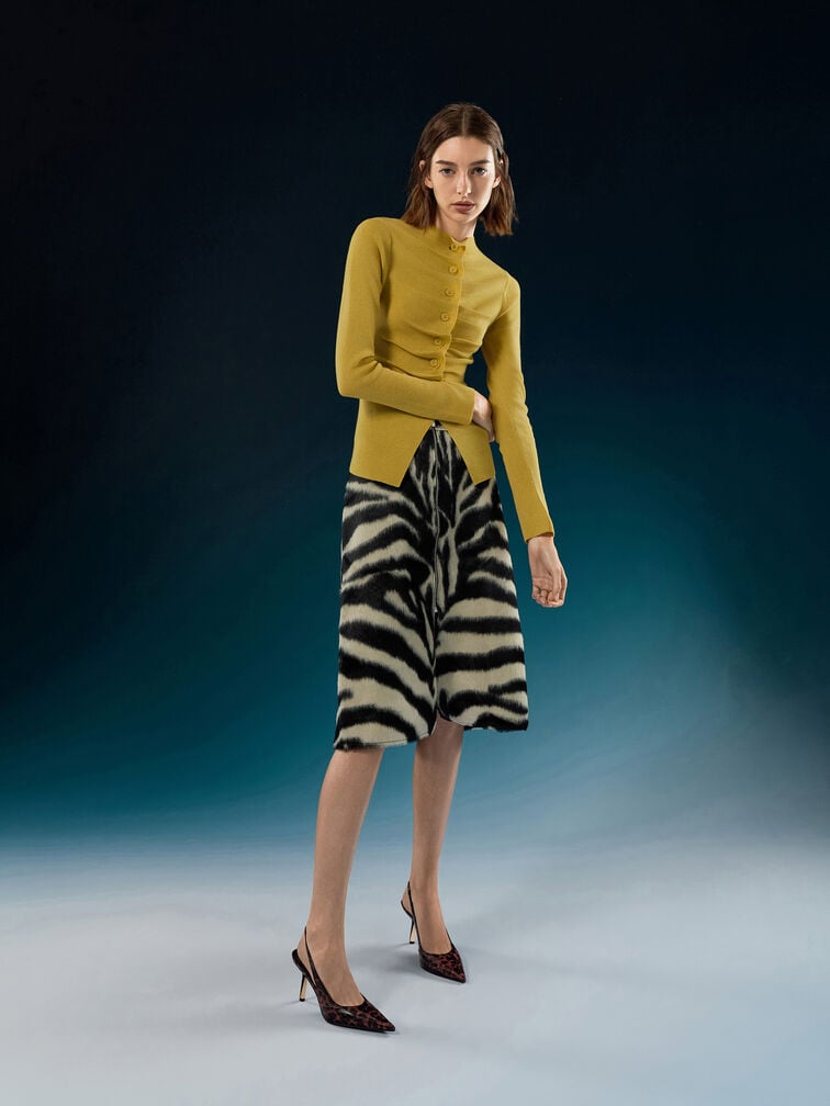 Pointed leopard-print slingback heels look professional without being overly formal.