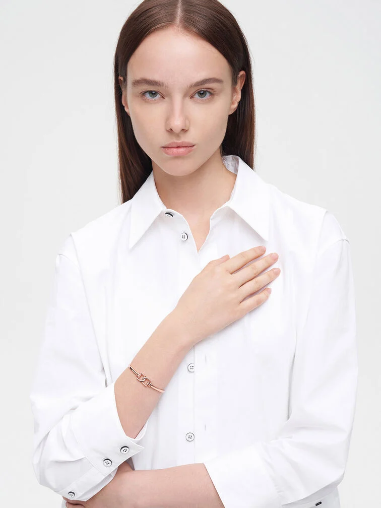 A white collared shirt will look smart under your graduation gown.  