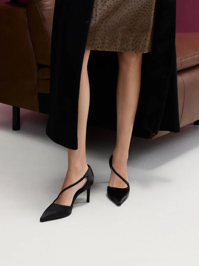 Black d’Orsay stiletto pumps, a foolproof complement to formal outfits.