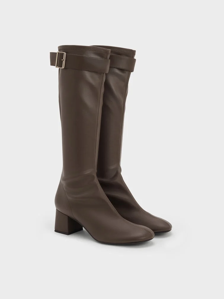 Buckled block-heel knee-high boots in dark brown.
