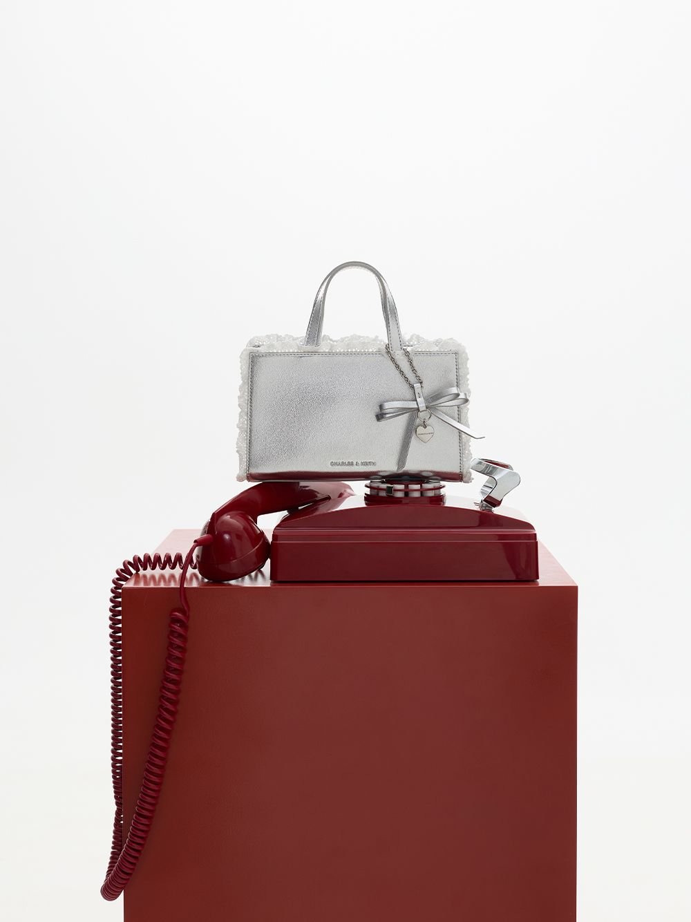 Women’s silver Raina satin metallic lace-trim bow-heart tote bag - CHARLES & KEITH