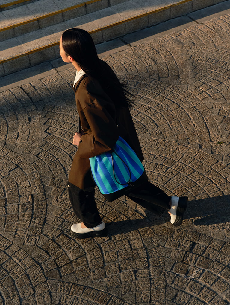 Women’s curved platform Mary Janes and large striped bucket bag  from the Short Sentence x CHARLES & KEITH collection - CHARLES & KEITH