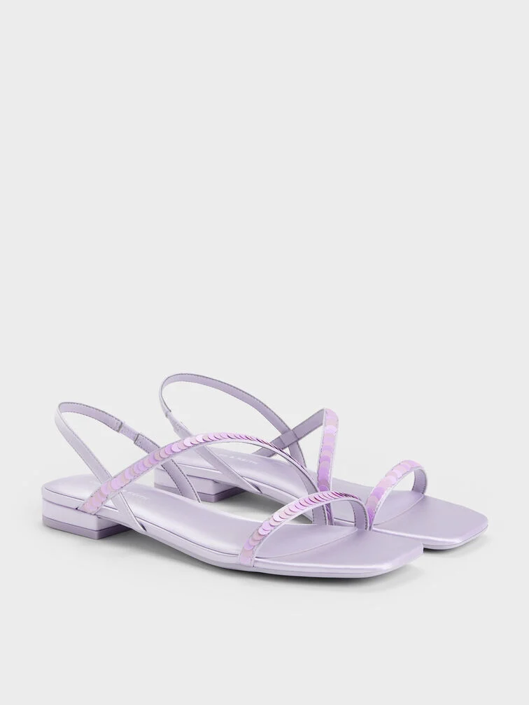 Lilac sequinned strappy sandals, a chic yet comfortable choice for party wear.