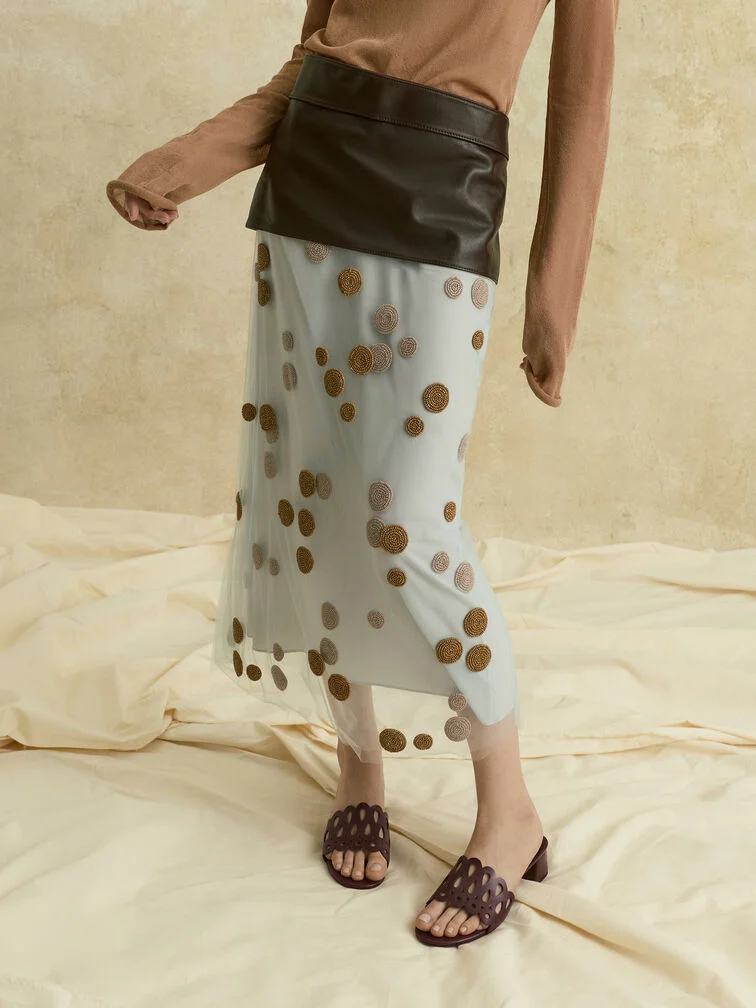 Offering comfort and convenience, heeled mules mirror the low-effort nature of casual dressing.