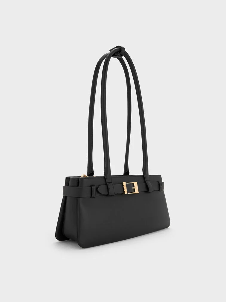 Black shoulder bag with belted detail and an oblong East-West silhouette.