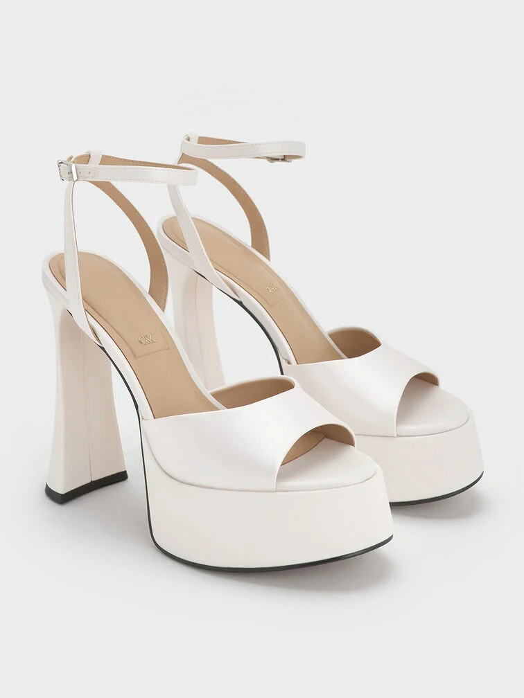 Platform sandals maximise the leg-lengthening effect of a short dress.