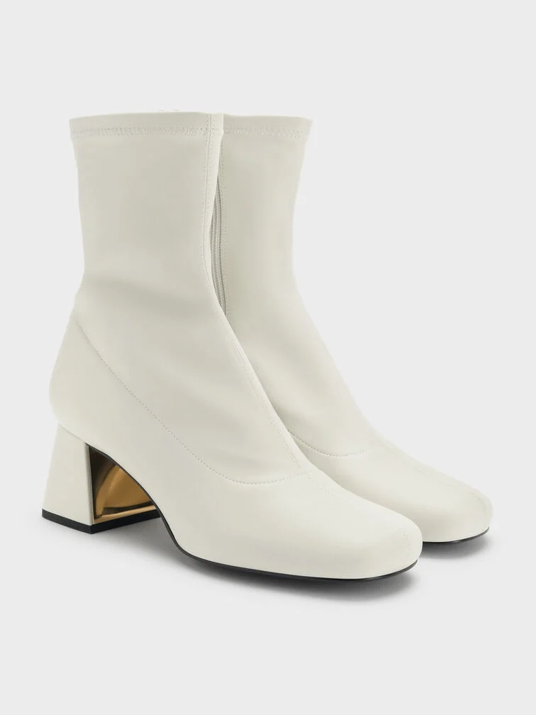 A pair of chalk ankle boots that will complement a winter white outfit.