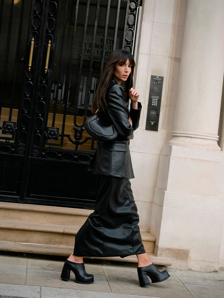Women’s Petra curved shoulder bag and Pixie platform mules in black, as seen on Ivona Zupet – CHARLES & KEITH