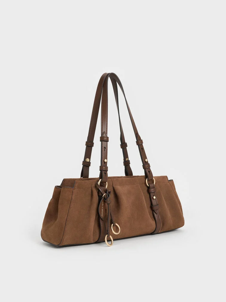 Mocha brown Britton suede ruched East-West bag, a versatile choice with a vintage vibe.