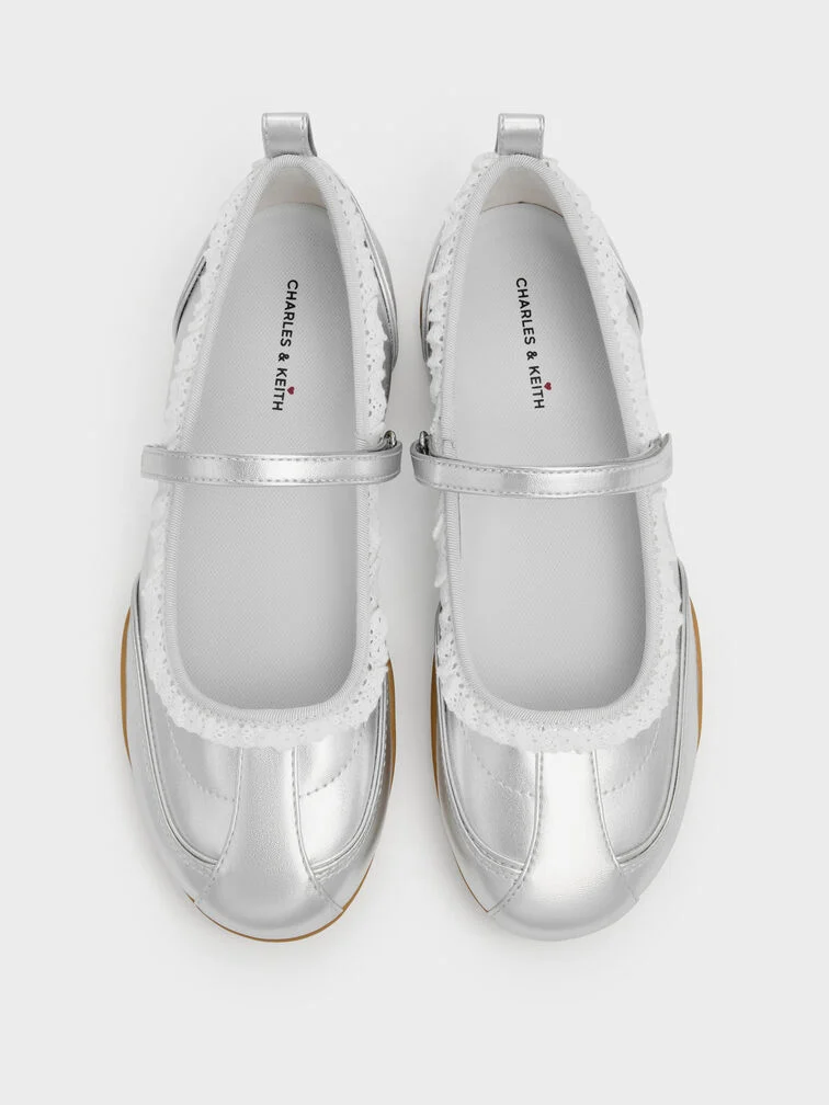 Mary Jane sneakers featuring a shiny metallic finish and lace-trims are a dressy option for special occasions.