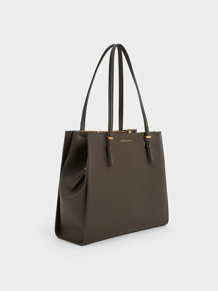 Moss-green tote bag with a boxy rectangular silhouette.