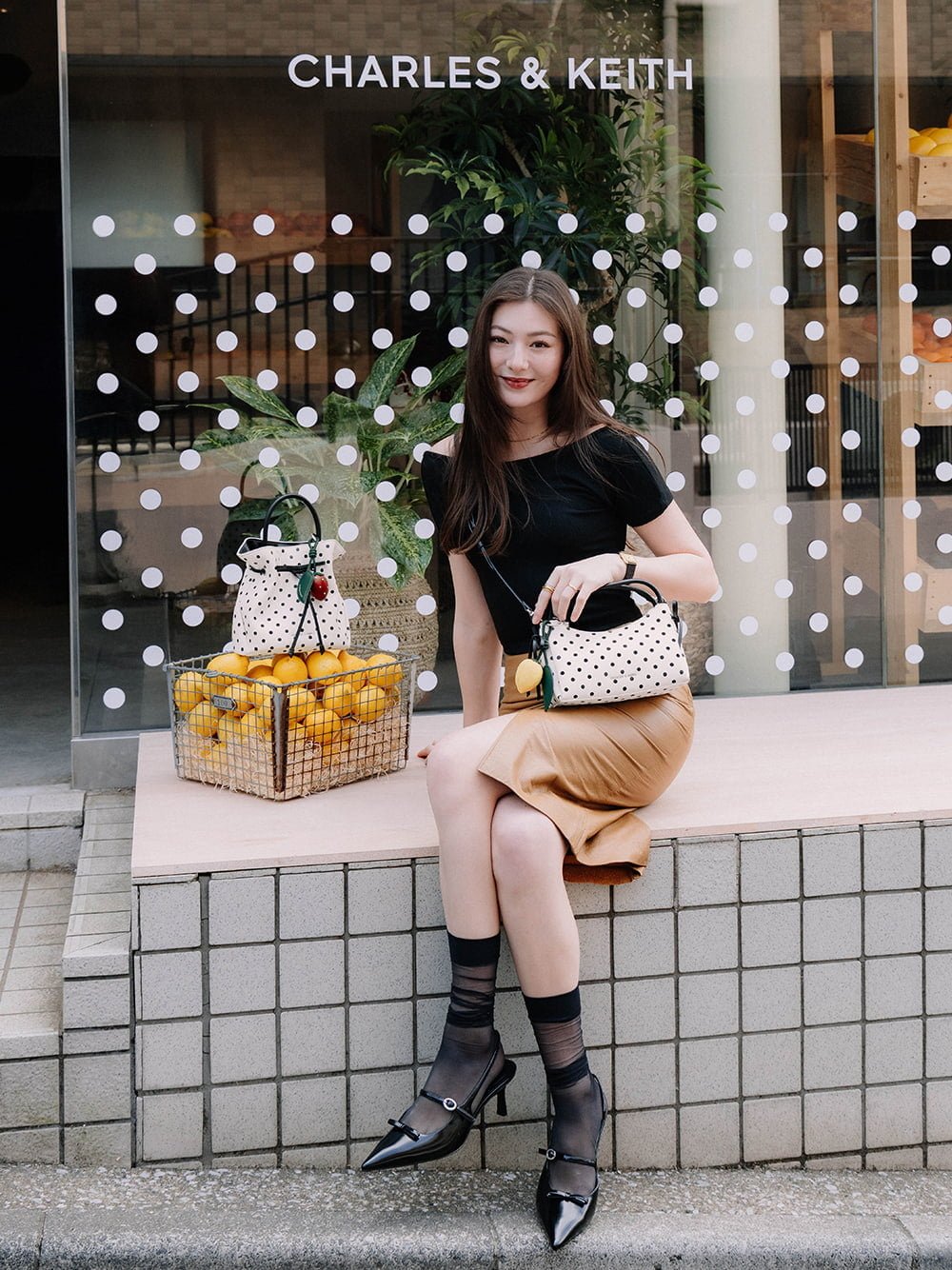 Hazel Bow Polka-Dot Top Handle Bag in cream and lemon charm - CHARLES & KEITH