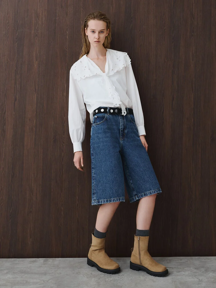 Camel brown calf boots styled with a white prairie blouse and indigo jorts.