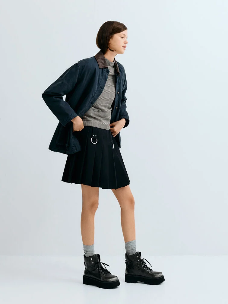 Chunky platform combat boots in dark grey, perfect for anchoring a mini skirt ensemble.