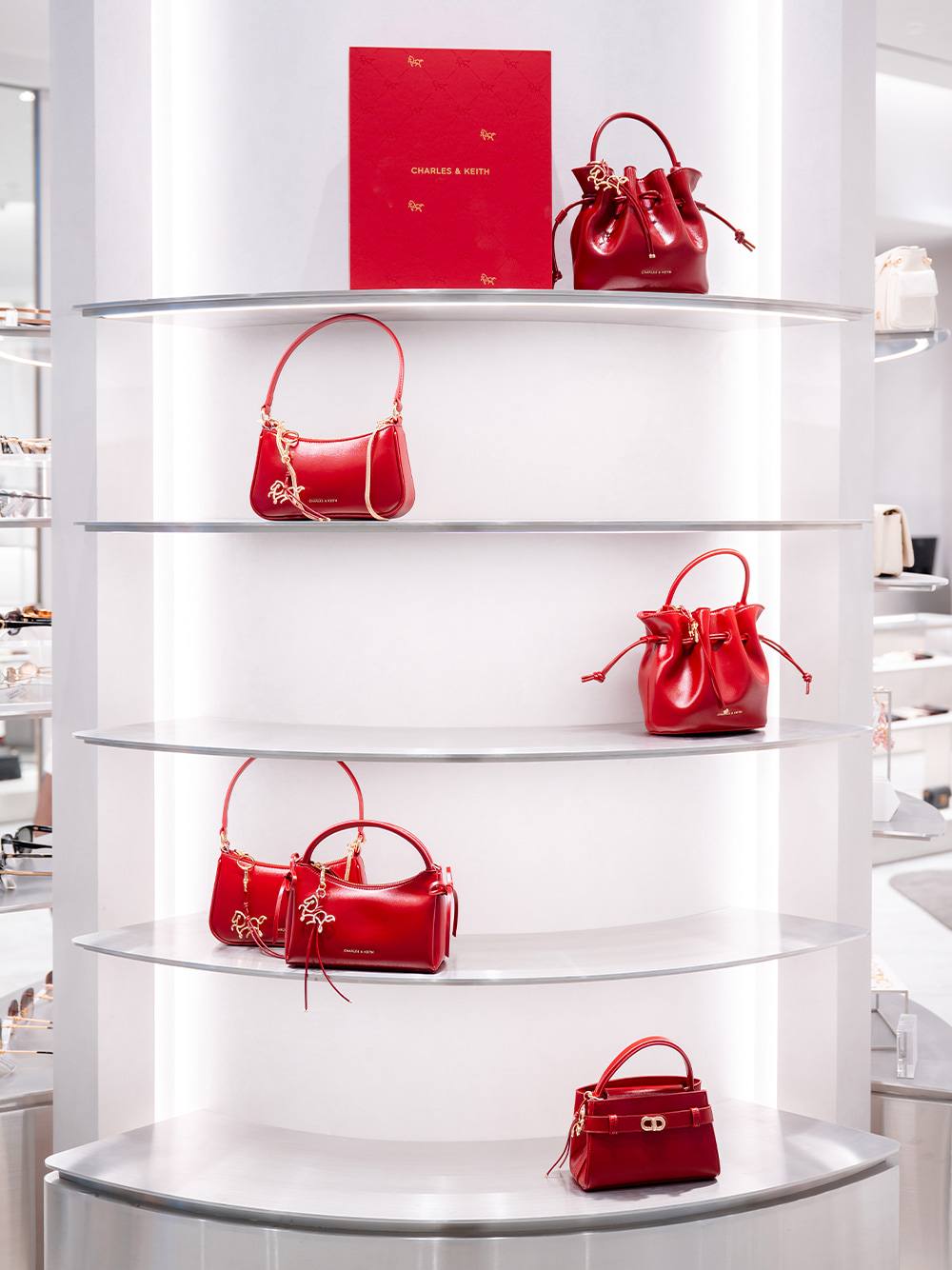 Women’s Hazel bow horse-motif top handle bag and Aubrielle horse-motif top handle bag - CHARLES & KEITH